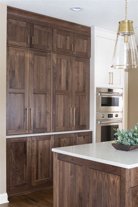 Walnut kitchen - Walnut cabinets is a popular kitchen style. Walnut kitchen could be made with modern slab (flat) doors or transitional shaker 5-peice doors (or its variations). The difference is that for flat doors - we would use walnut veneer, and for shaker walnut doors - solid walnut. Walnut looks beautiful in a face frame …
